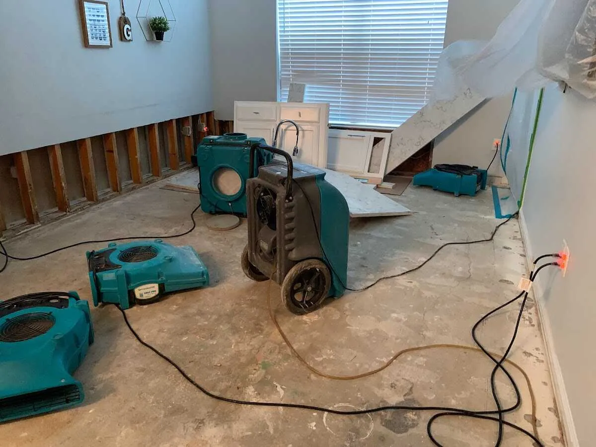 Dehumidifier in flood-cut room for Water Damage Restoration in Fairport